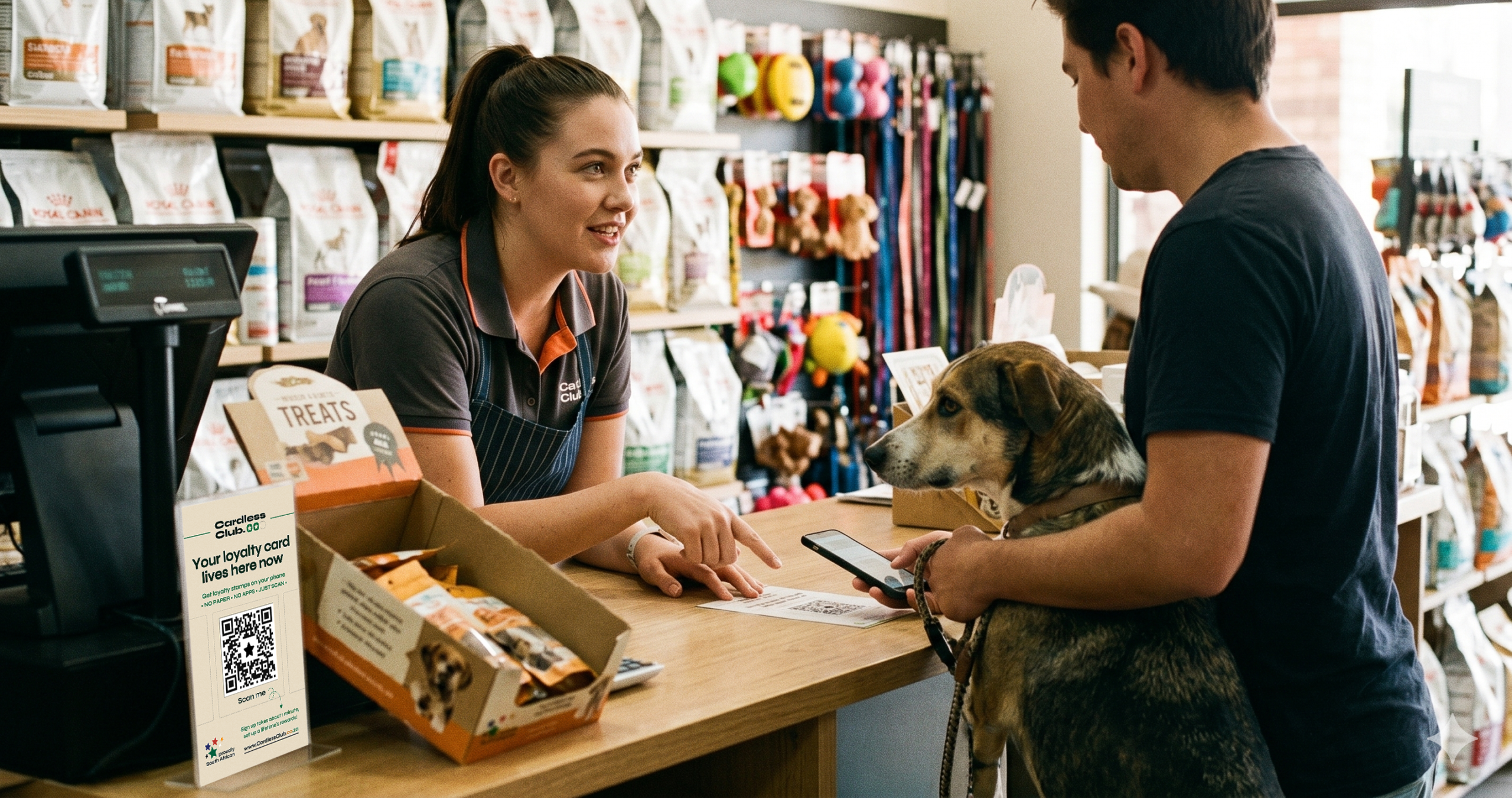 A pet shop assistant helping a customer scan at the counter